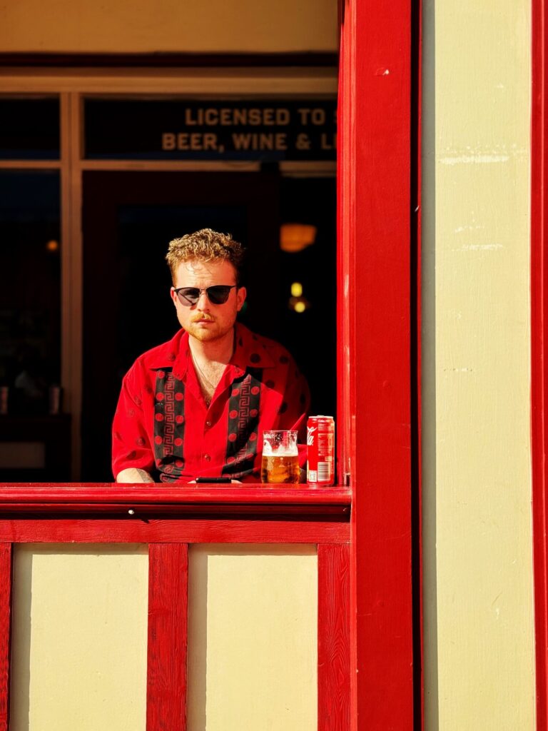 treet photograph of a man in a red shirt and sunglasses at a
colourful Dublin pub window, Brendan Ó Sé workshop